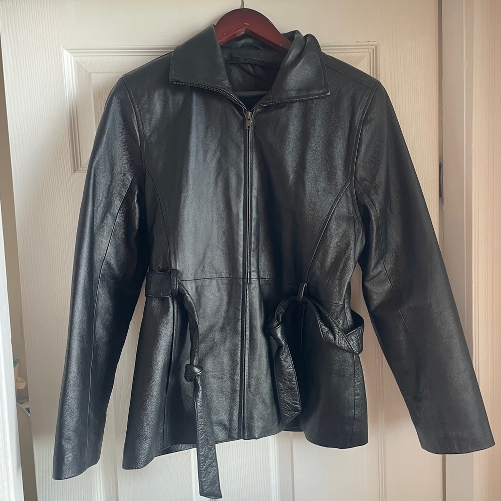 Vintage leather black jacket size small. Good condition.